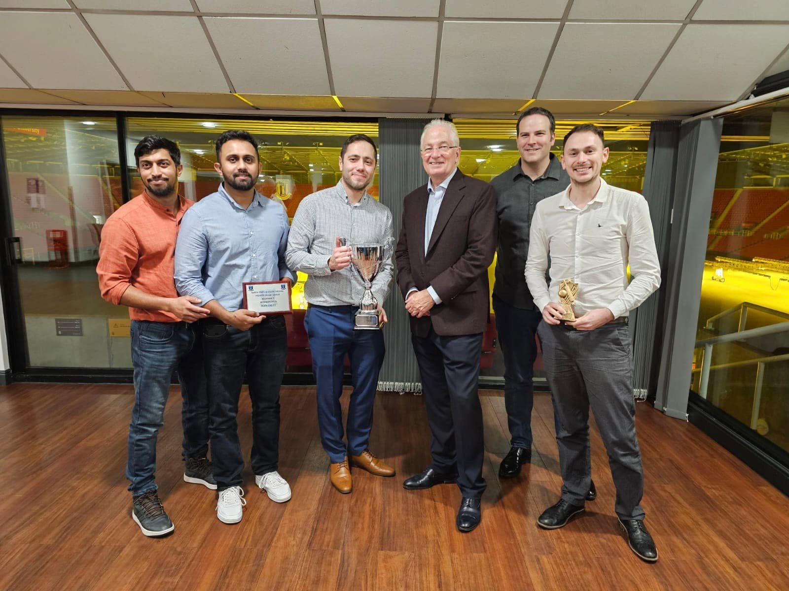 Audlem Cricket Club awards night — players with league trophies and plaques
